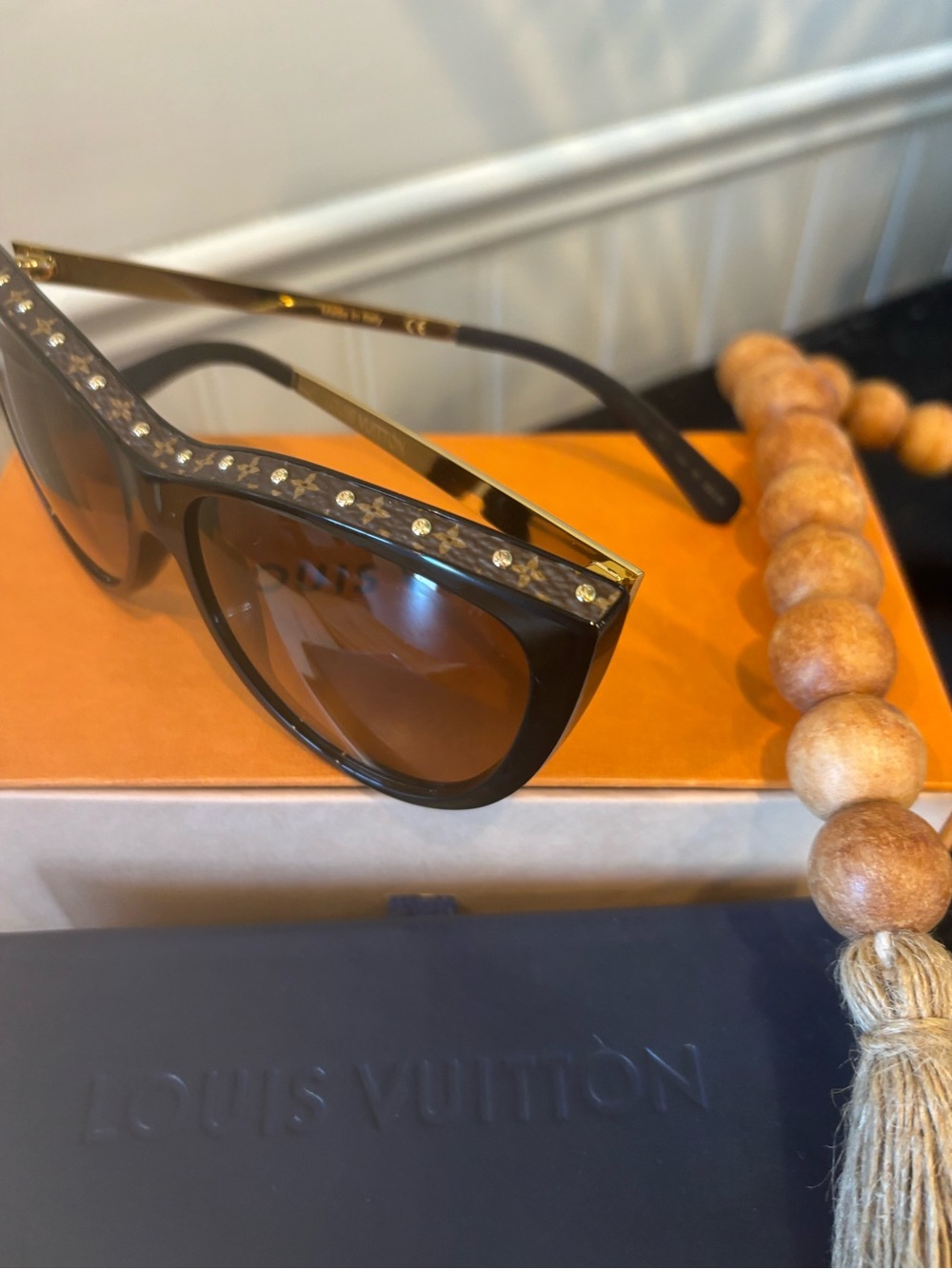 Louis Vuitton brown cat-eye sunglasses with gold stud accents. - Picture 4 of 12